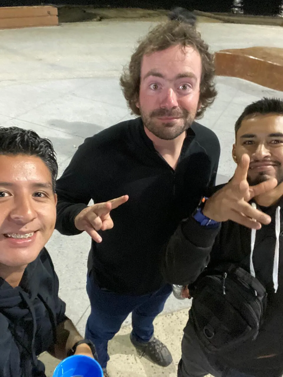 Mexican friends celebrating the football win by giving me beer