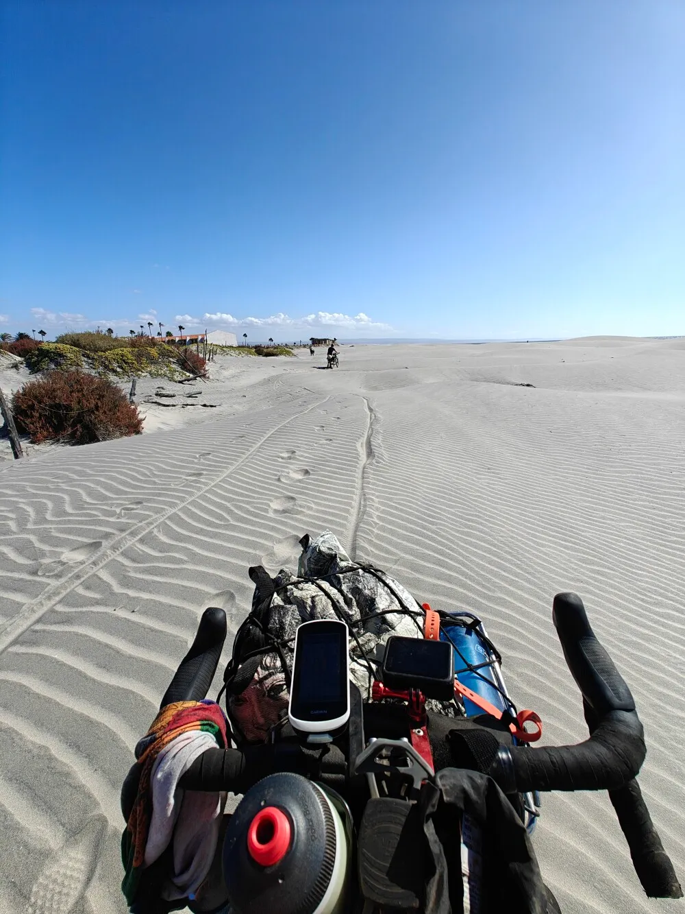 Lots of pushing bike through sand