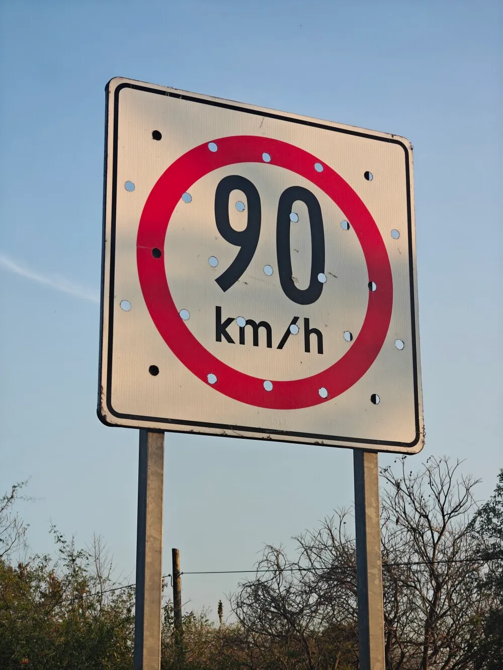 I guess the holes are in the signs to help with the wind?